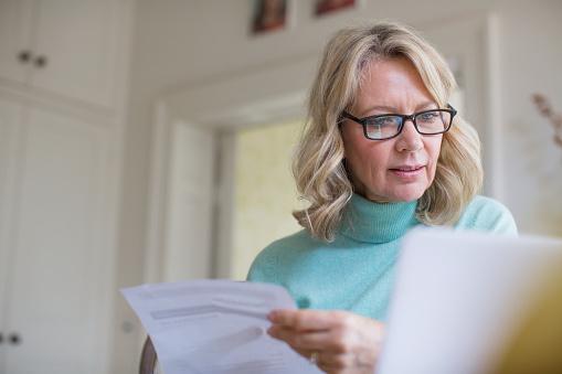 Woman checking bills